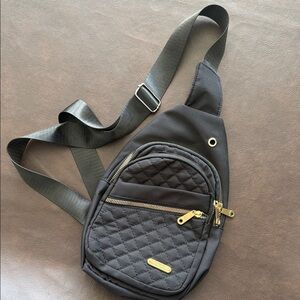 Elegant Black Quilted Crossbody Bag with Gold Accents